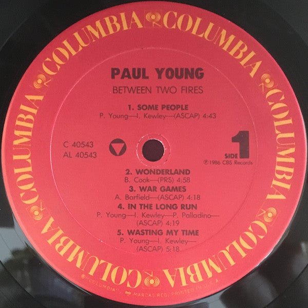 Paul Young : Between Two Fires (LP, Album, Pit)