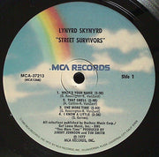 Lynyrd Skynyrd : Street Survivors (LP, Album, RE, Pin)