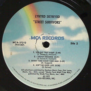 Lynyrd Skynyrd : Street Survivors (LP, Album, RE, Pin)