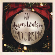 the album cover for Aaron Watson - An Aaron Watson Family Christmas: Re-Wrapped (Grn)