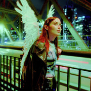 the album cover for Hatchie - Giving The World Away [Coke Bottle Clear LP]