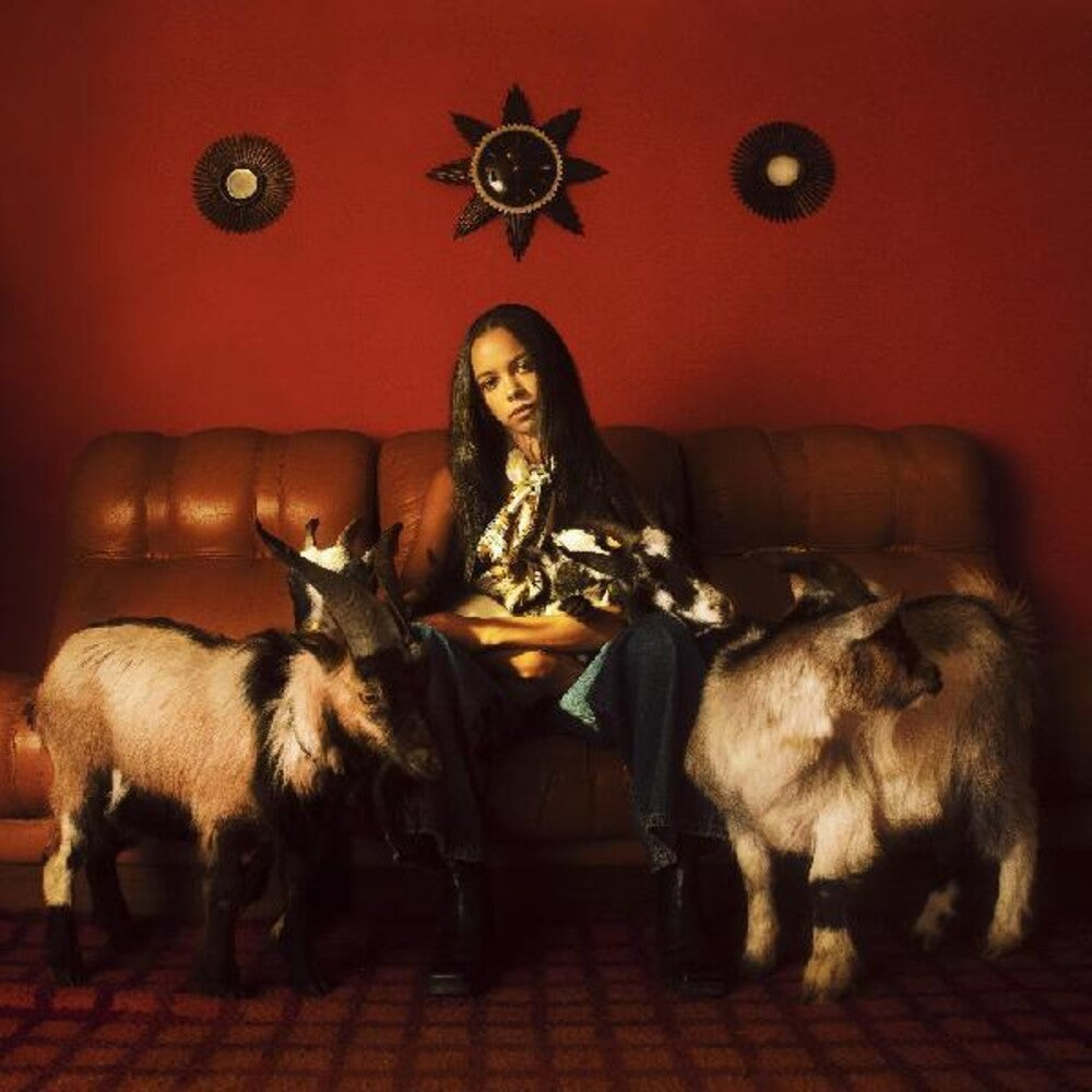 the album cover for Tsha - Capricorn Sun [Red Marbled 2LP]