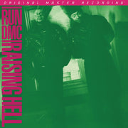 the album cover for Run Dmc - Raising Hell [180 Gram]
