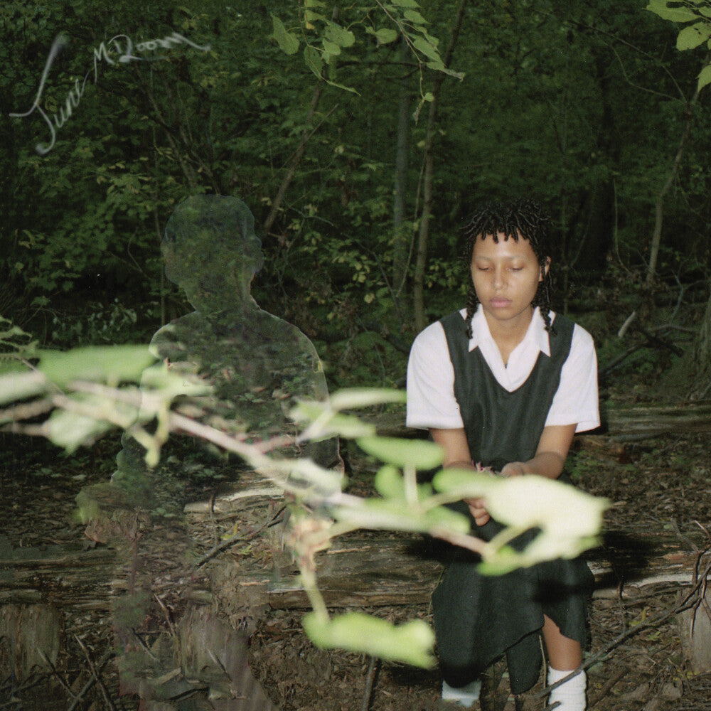 the album cover for June McDoom - June Mcdoom - Crystal Clear W/Green [Clear Vinyl] (Grn)