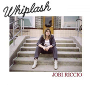 the album cover for Jobi Riccio - Whiplash [Coke Bottle Clear LP]