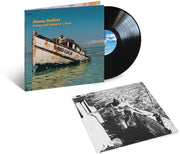 the album cover for Jimmy Buffett - Living And Dying In 3/4 Time