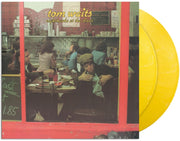 the album cover for Tom Waits - Nighthawks At The Diner (Anniversary Edition) [Yellow Marble LP]
