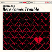 the album cover for Angela Tini - Here Comes Trouble [Deluxe] (Post)