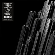 the album cover for Theory Hazit - At All ft. Iman Omari b/w At All (STLNDRMS Remix)