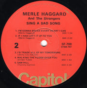 Merle Haggard And The Strangers (5) : Sing A Sad Song (LP, RE, Win)